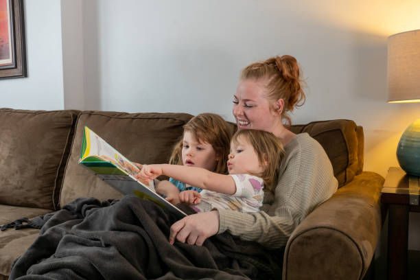 istock A mother reading to her children 1465293999