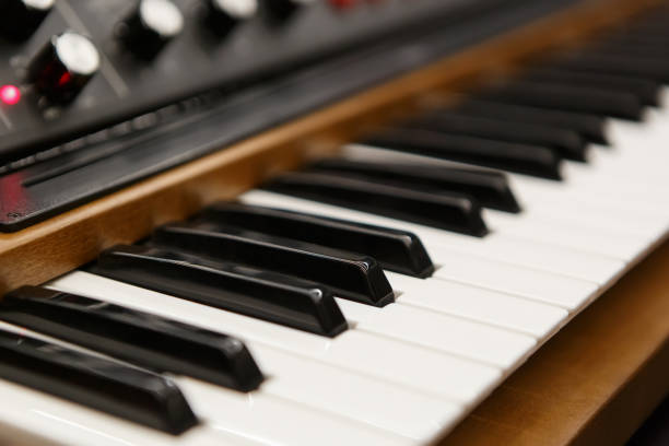 Modern synthesizer piano for music composer. Professional musical instrument in sound recording studio