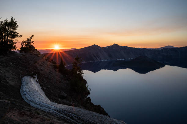 istock Sunset Rays Over the Mountains Behind Crater Lake from Garfield Peak 1465300447