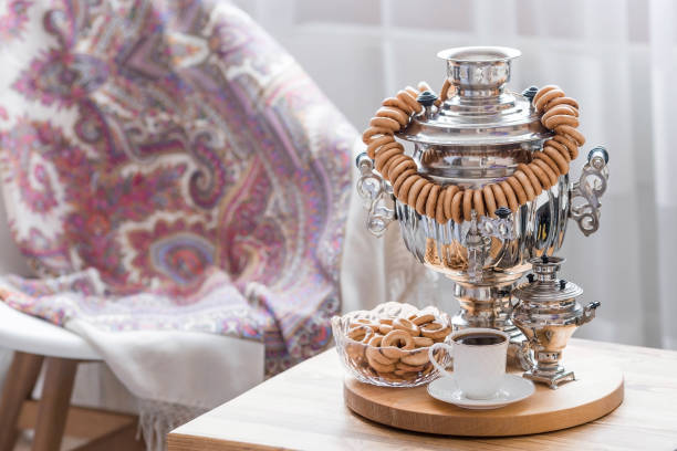 Russian traditions. Tea drinking with a samovar. Still life with bagels, bagels and Russian samovars in the interior of a modern living room. Russian culture.