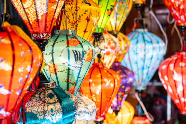 Paper ornamental lanterns in Hoi An Ancient town night market shop stock photo