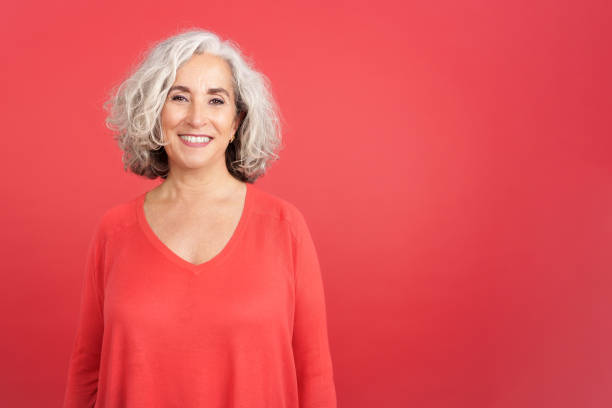 istock A mature woman smiling at the camera 1465309349