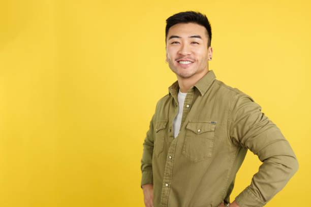 istock Handsome chinese man standing smiling at the camera 1465309648