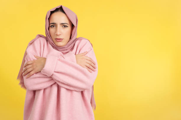 istock Muslim woman looking at camera in the cold 1465309716