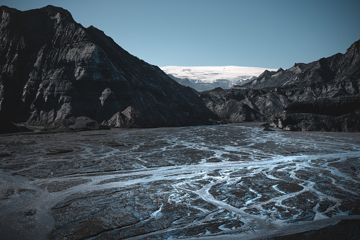 Glacial river flows out of the melting glacier Myrdalsjokull near Katla volcano in South Iceland.
