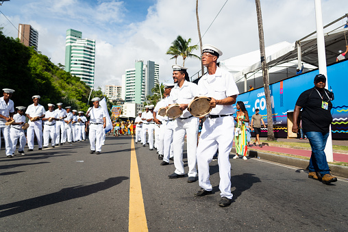 Salvador, Bahia, Brazil - February 11, 2023: Traditional Marujada group dressed as sailors perform during the Fuzue parade in Salvador, Bahia.