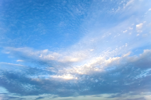 Soft white blurred clouds on a gentle blue sky on a sunny day. Wallpaper. Background. Beauty in nature