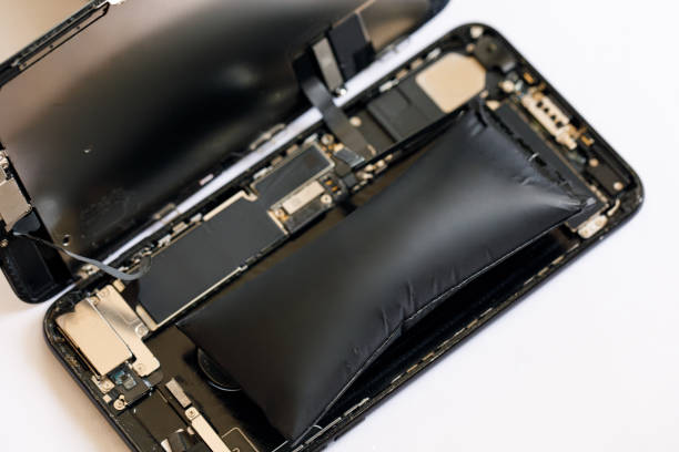 istock Swollen smartphone battery. Damaged smartphone battery 1465323791