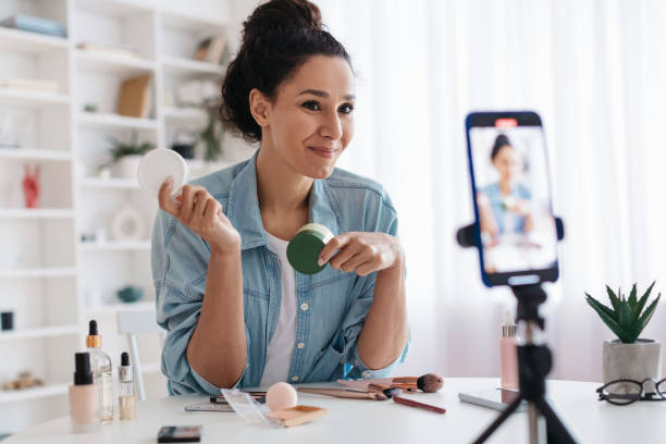 istock Professional Beauty Blogger Woman Using Smartphone Making Video Indoors 1465326312