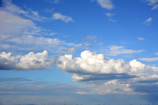 cloudscape with blue sky and white clouds isolated, close-up