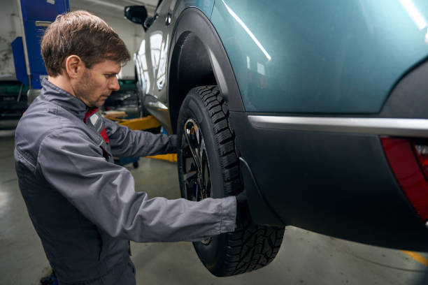 istock Man inspecting wheel bearing runout in the workshop 1465335895