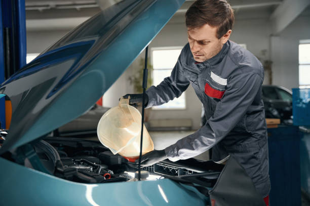 istock Man conducts full technical inspection of car 1465336052