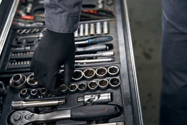 istock Man chooses instruments for car repair at work 1465336061
