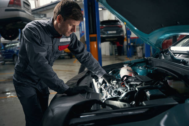 istock Mechanic conducts full technical check of auto 1465336082