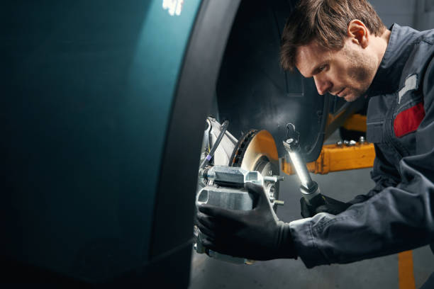 istock Male doing inspection of the brake system 1465336130