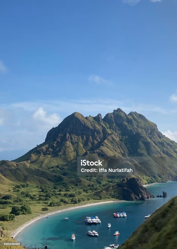 Padar Island Potrait of Hill in Padar Island with a sea and blue sky view Adventure Stock Photo