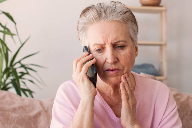 istock Unhappy stressed mature middle aged woman looking at phone screen 1465337789