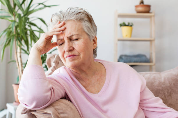 istock middle aged lady looking away sit alone at home feel anxious lonely, sad 1465337954