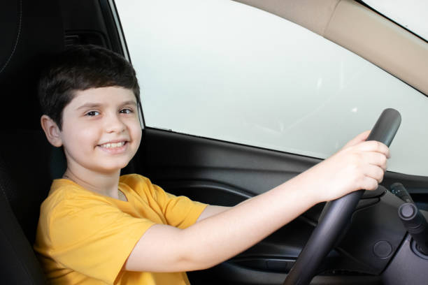 istock Boy playing in the family car 1465338867