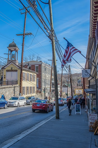 Ellicott City, MD, USA - February 11, 2023: The image is of Old Town Ellicott City, Maryland. The image is taken from the ground level with unrecognizable people in the photo during the day.