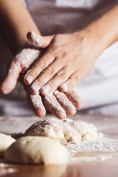 istock A Woman is Kneading Dough 1465340108