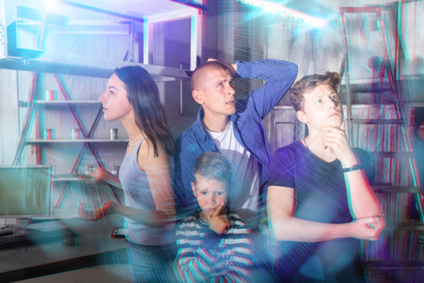 istock Brooding family tries to find a solution to a puzzle in a quest room 1465343605