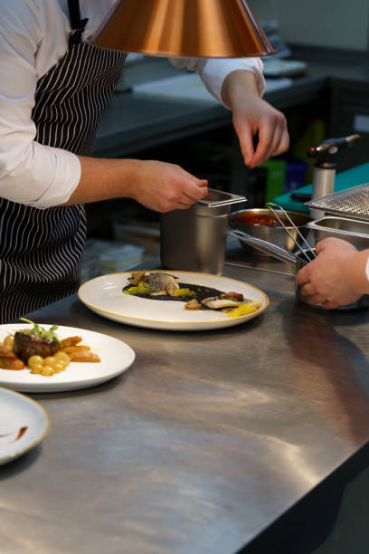 istock The cook decorates an exquisite dish. 1465344773