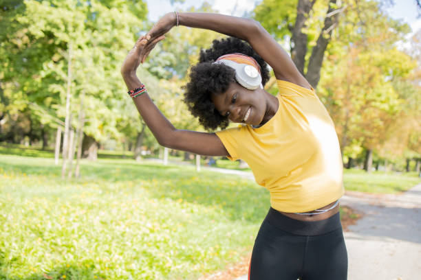 istock A young woman enjoys exercising outside 1465351725