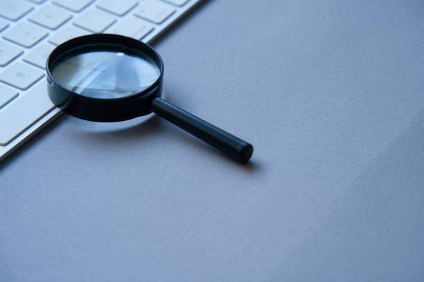 istock Magnifying glass and laptop keyboard. Seo. 1465351784