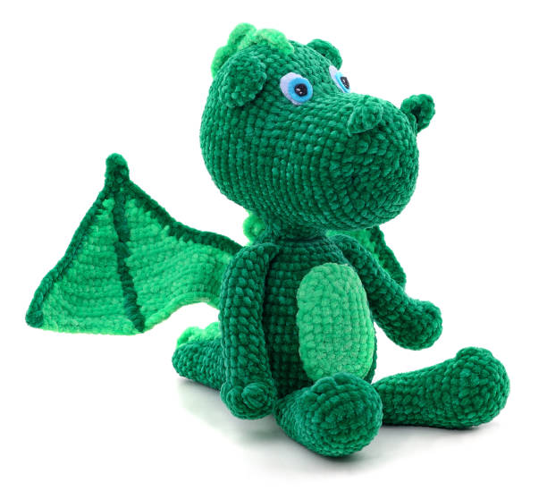 istock Green knitted dragon toy. 1465354724
