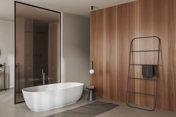 istock Light bathroom interior with tub and rail ladder on beige concrete floor 1465355368