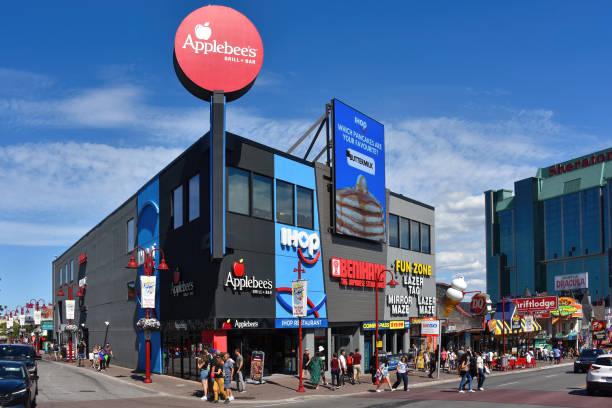 Clifton Hill in Niagara Falls, Canada Niagara Falls, Canada - August 13, 2022: Applebee's, IHOP, Bennihaha and Fun Zone Laser Tag on Clifton Hill, a popular tourist destination. Ihop stock pictures, royalty-free photos & images