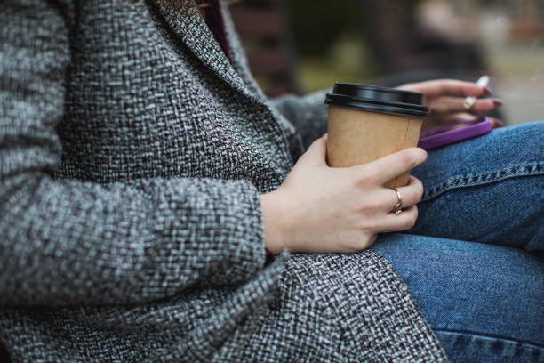 istock Smoking. Paper cup and mobile phone in hand 1465357570