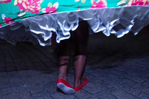 A close-up view of the circular skirt from a member performing a the street carnaval