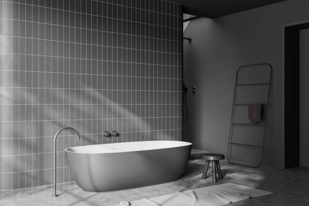 istock Grey bathroom interior with bathtub and towel rail ladder. Empty wall 1465359275