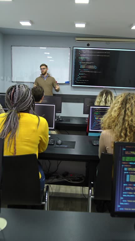 Group of people learning computer programming