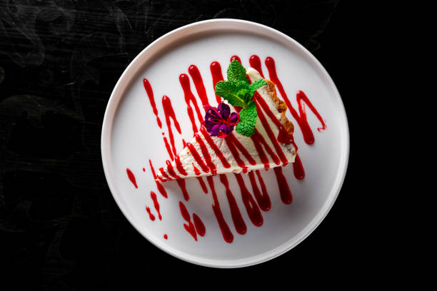 istock Strawberry cheesecake served on plate on black wooden table background 1465361020