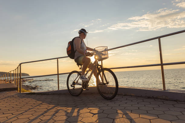 istock Riding a bike on a beautiful sunset 1465361059
