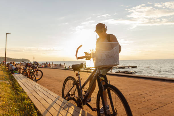 istock Riding a bike on a beautiful sunset 1465361114