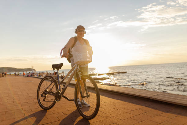 istock Riding a bike on a beautiful sunset 1465361284