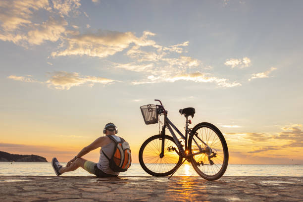 istock Listening music and watching sunset 1465361558