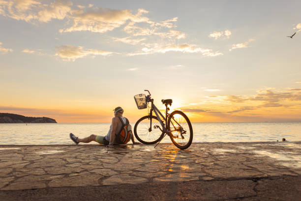 istock Listening music and watching sunset 1465361568
