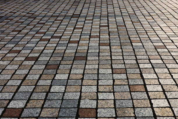 istock Low angle close up photo for background material in a cobblestone road 1465361796
