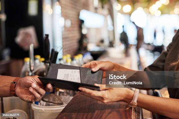 Hands With Bill Food Service And People In Restaurant Customer With Receipt And Payment With Cashier Or Waiter Fine Dining Dinner And Check At Cafe Catering And Hospitality With Finance Stock Photo - Download Image Now