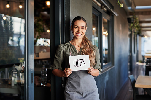 Restaurant, open sign and store portrait of woman, startup small business owner or coffee shop manager. Retail sales, commerce service and cafe waitress, barista or entrepreneur happy for success