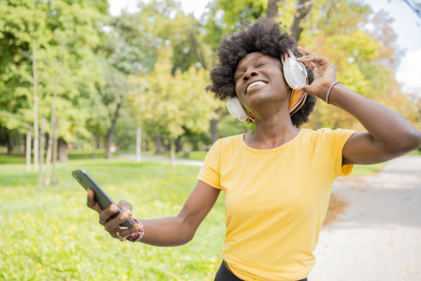 istock Happy young woman using phone 1465364666