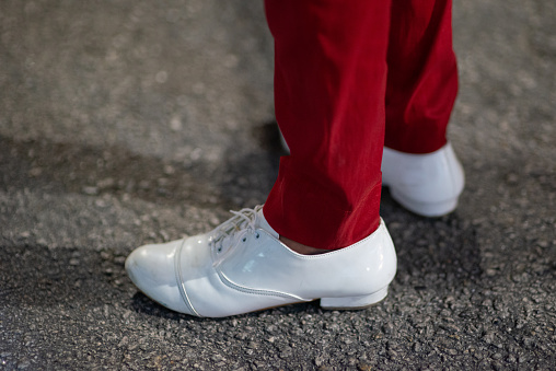 A close-up image of a man's samba shoes