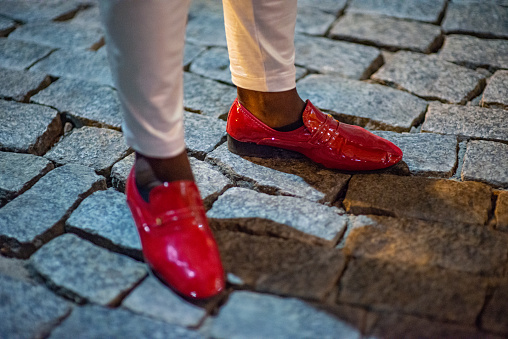 A close-up image of a man's samba shoes