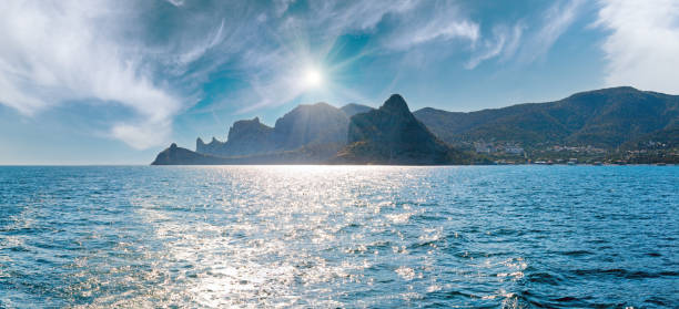 Scintillate sea surface and evening summer rocky coastline  (Crimea, Ukraine).