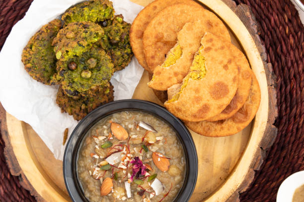 istock Dal Bhari Poori, Dholl Puri, Cholar Dal, Luchi Served With Gur Ki Kheer Or Jaggery Rice Pudding, Nolen Gurer Payesh, Rasiyaw, Payasam, Hara Chana Or Chholia Pakoda Bhabhra, Tamatar Ki Meethi Chutney 1465371692